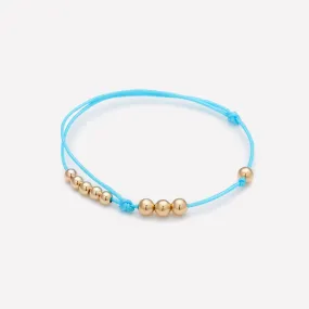 MISHA TURQUOISE STRING BRACELET