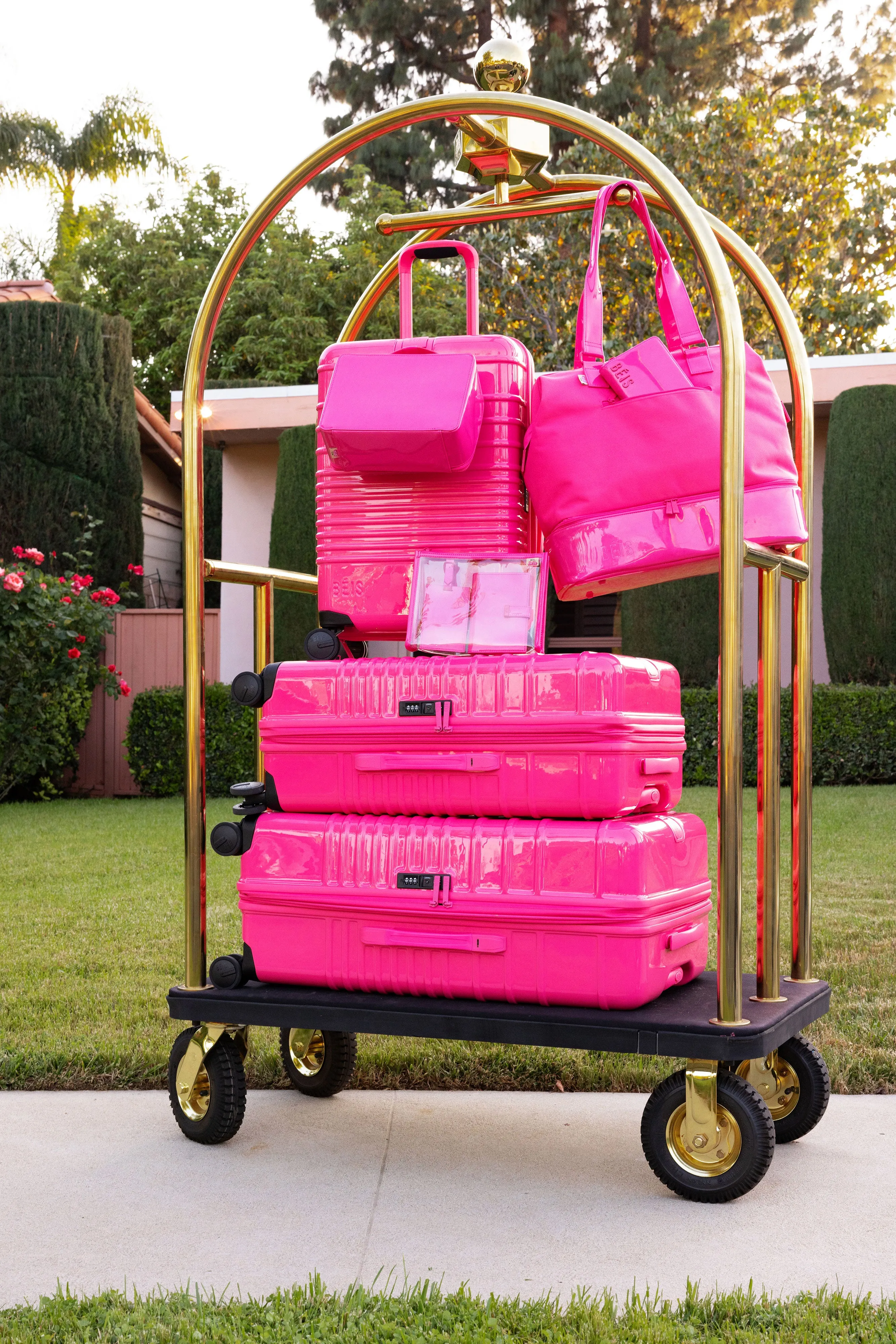 The Medium Check-In Roller in Barbie Pink